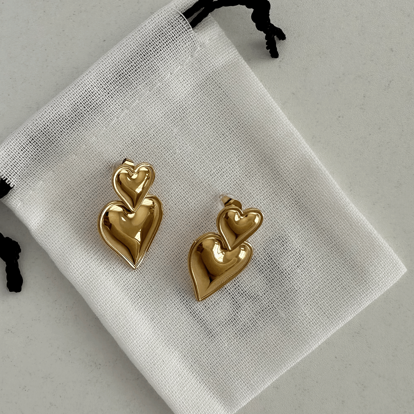 DOUBLE HEART DROP EARRINGS GOLD